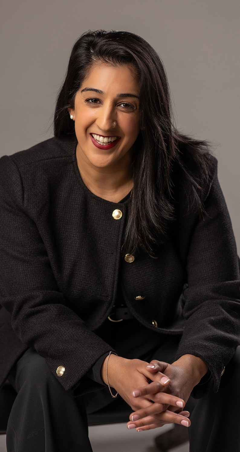 Dr. Aman Ahluwalia-Cameron A headshot style photograph of Dr. Aman Ahluwalia-Cameron.
